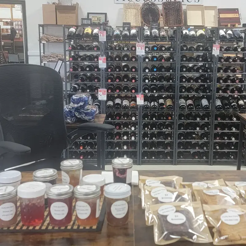 Sample jars, baked goods, and wine racks in the shop
