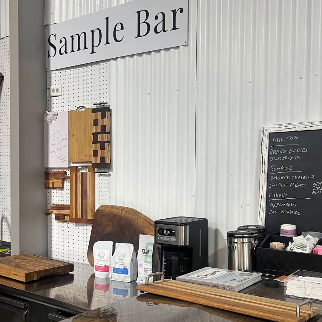 Sample Bar counter with cheese board, coffee, and the day’s sample menu