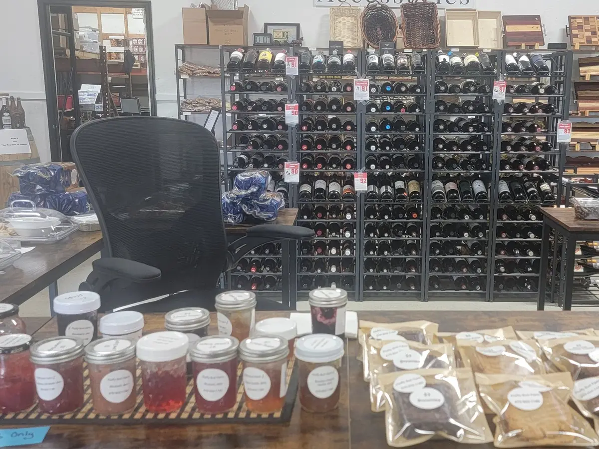 Sample jars, baked goods, and wine racks in the shop